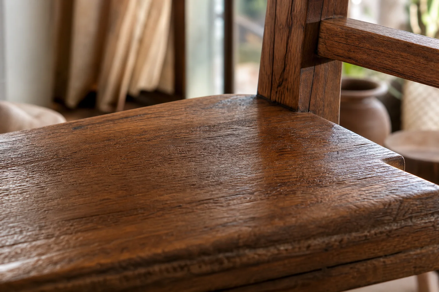How Long Does Teak Wood Furniture Actually Last? 1 Close-up of aged solid teak wood grain on a finished furniture piece showing natural durability. photorealistic close-up macro shot of solid teak wood furniture surface, showing rich warm brown grain texture with natural oils giving a soft